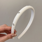 A Luxurious And Stylish Satin Headband with a Silvery Bow, Perfect for High Hairstyles And Face Washing